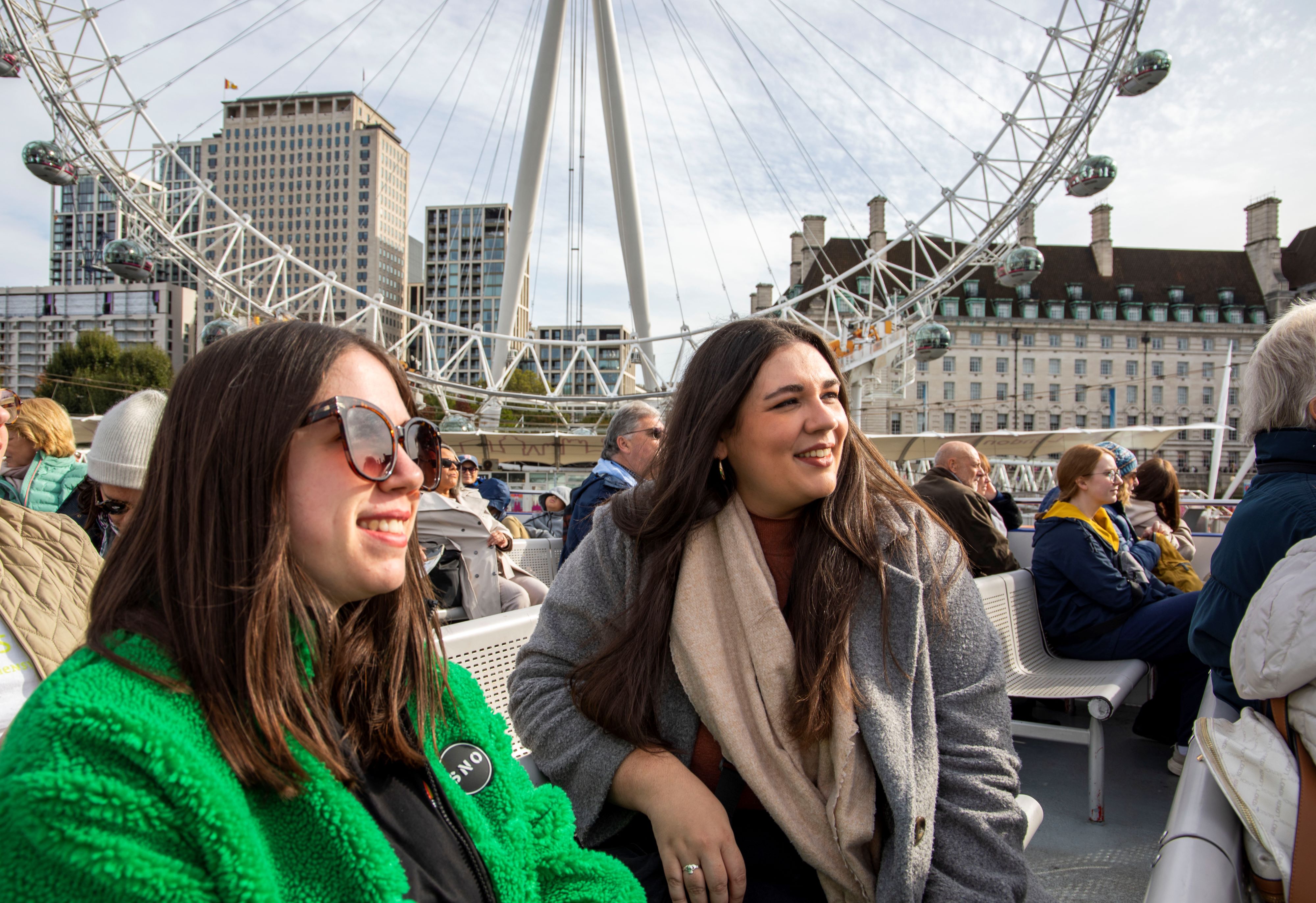 Guests aboard City Cruises in front of the London Eye