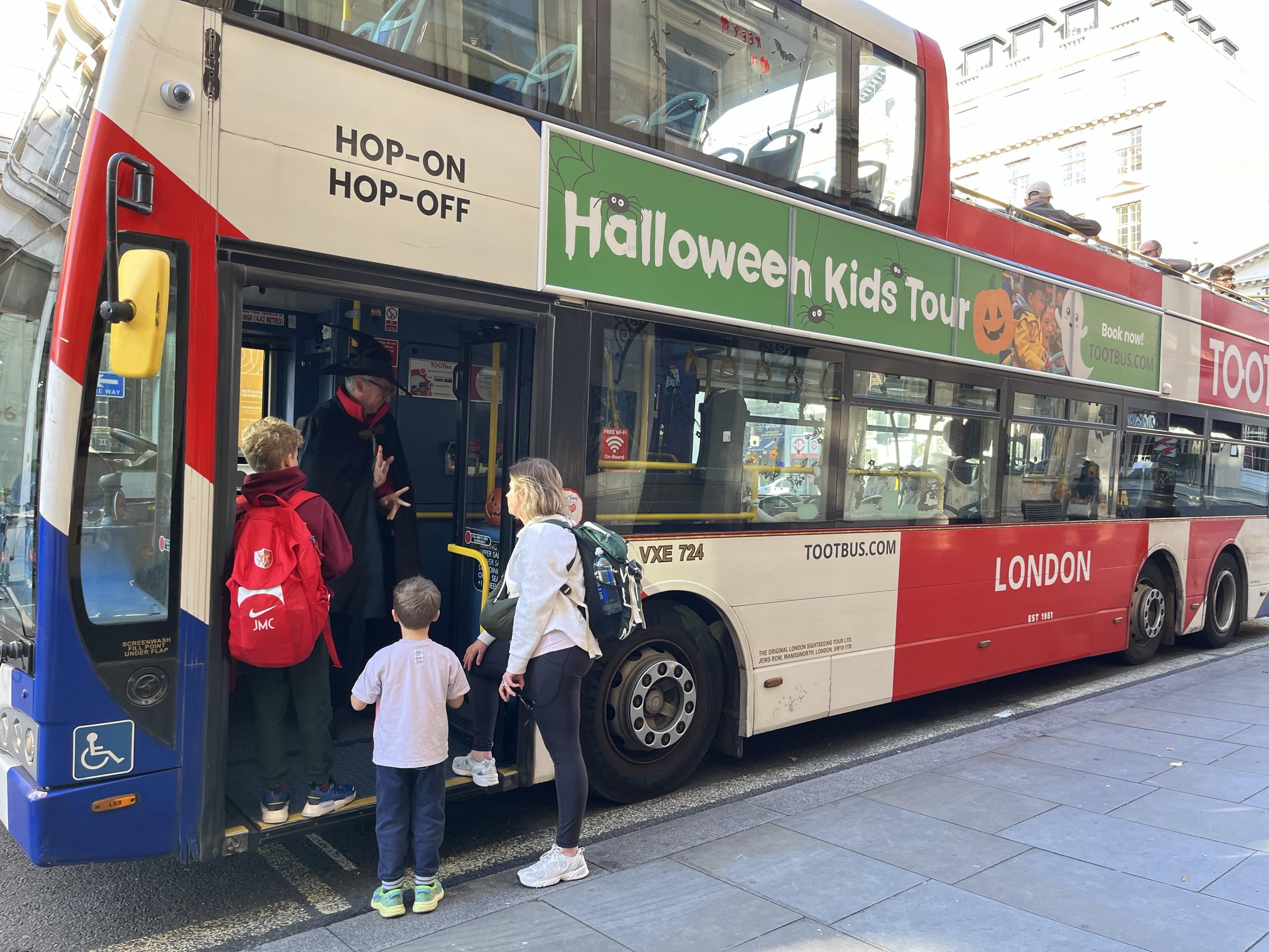 Mother and daughter enjoying kids bus tour
